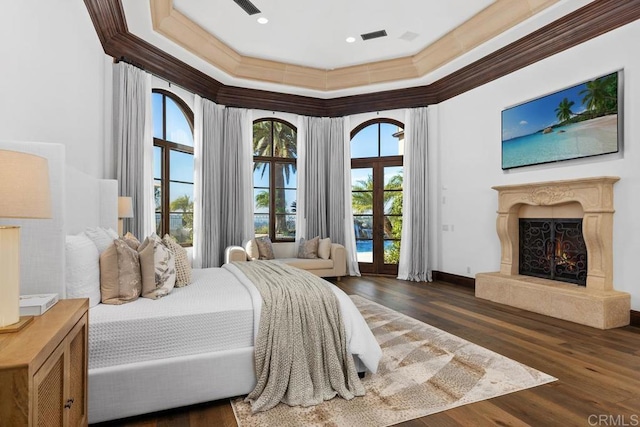 5015 Rancho Quinta Bnd, San Diego, CA 92130 - bedroom with crown molding, dark wood-style floors, access to outside, a premium fireplace, and french doors