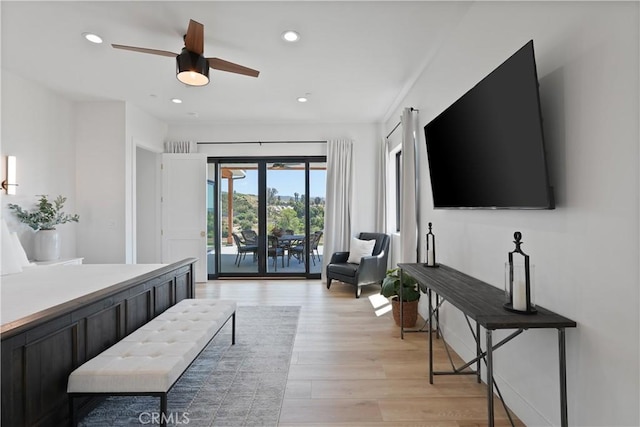 living room featuring recessed lighting, light wood-type flooring, and ceiling fan
