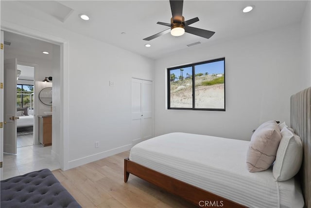 bedroom with light wood-style floors, ceiling fan, baseboards, visible vents, and recessed lighting