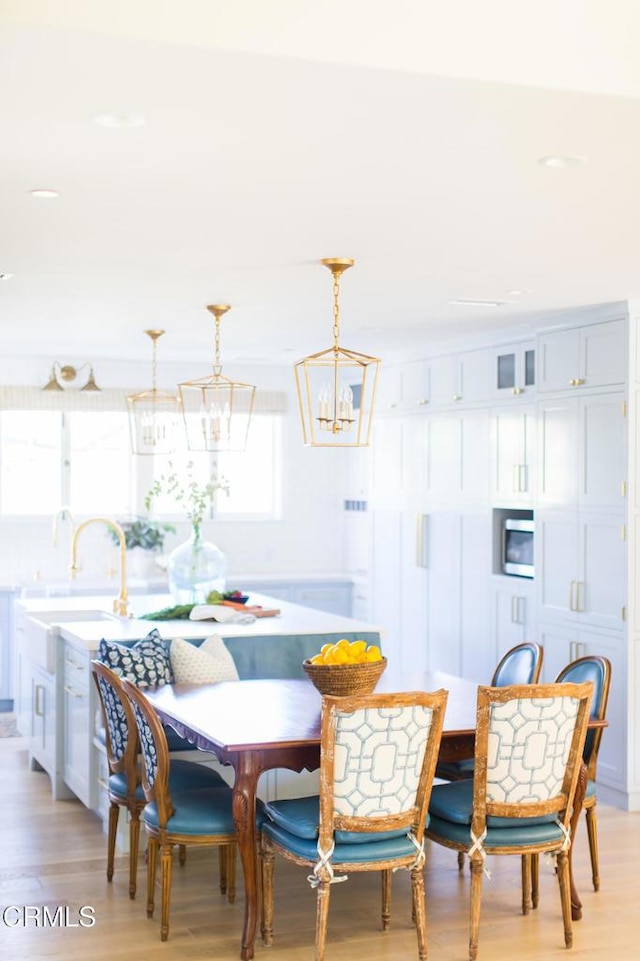233 Hillside Rd, South Pasadena, CA 91030 - dining room with light wood-style flooring and a chandelier