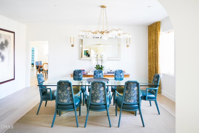 233 Hillside Rd, South Pasadena, CA 91030 - dining area with wood finished floors, arched walkways, and a chandelier