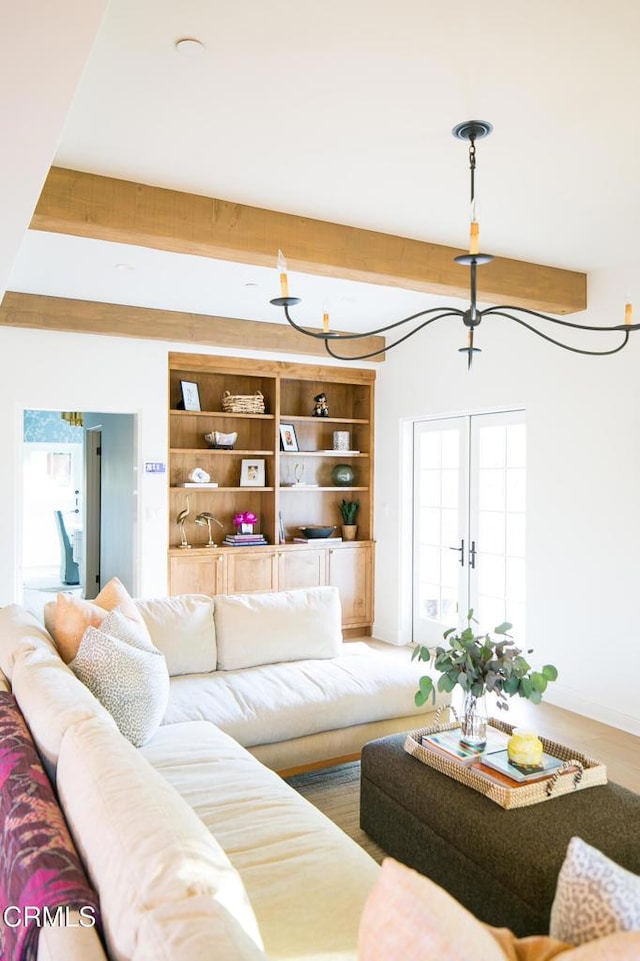 233 Hillside Rd, South Pasadena, CA 91030 - living area featuring healthy amount of natural light, beamed ceiling, and french doors