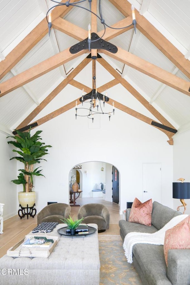 233 Hillside Rd, South Pasadena, CA 91030 - living room featuring arched walkways, a chandelier, high vaulted ceiling, and beamed ceiling