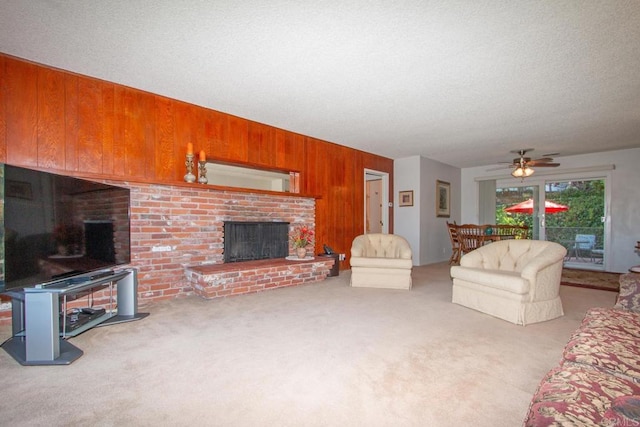 1143 Portola St, Vista, CA 92084 - living area with a brick fireplace, carpet, wood walls, and ceiling fan