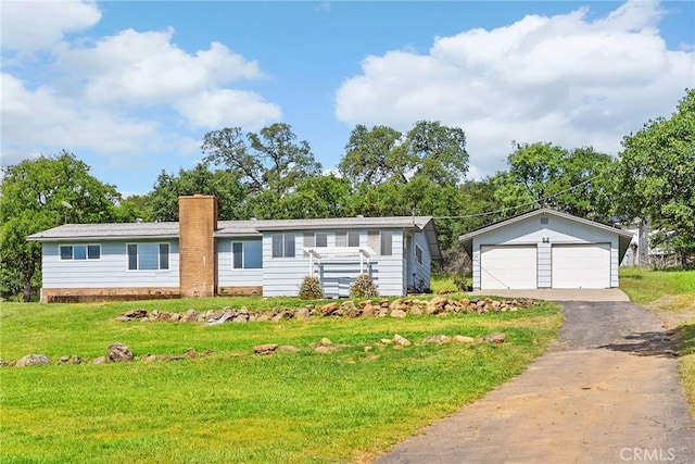 43 Zepher Way, Oroville, CA 95966 - ranch-style house with a detached garage, a front yard, and a chimney