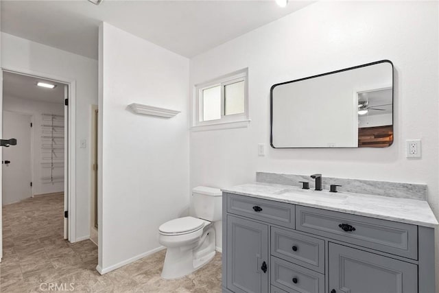 43 Zepher Way, Oroville, CA 95966 - bathroom featuring vanity, toilet, ceiling fan, a closet, and baseboards