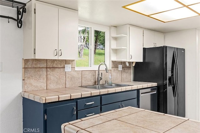 43 Zepher Way, Oroville, CA 95966 - kitchen with a sink, white cabinets, backsplash, open shelves, and blue cabinets