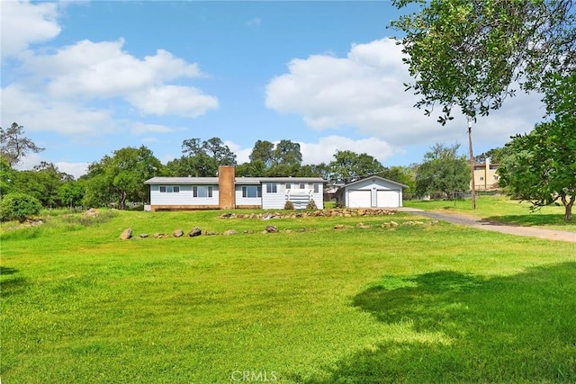 43 Zepher Way, Oroville, CA 95966 - manufactured / mobile home with a garage, a front lawn, an outbuilding, and a chimney