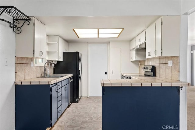 43 Zepher Way, Oroville, CA 95966 - kitchen featuring stainless steel electric stove, open shelves, tasteful backsplash, a sink, and tile counters