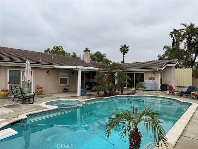 9033 Mandarin Ave, Rancho Cucamonga, CA 91701 - view of swimming pool featuring a patio and a pool with connected hot tub