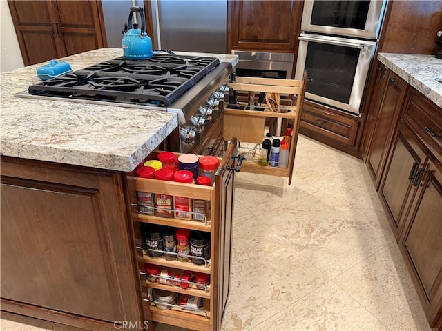 9033 Mandarin Ave, Rancho Cucamonga, CA 91701 - kitchen featuring appliances with stainless steel finishes and light stone counters