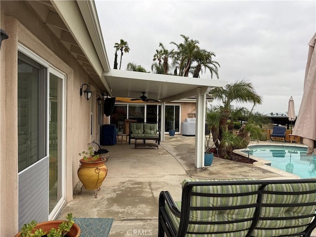 9033 Mandarin Ave, Rancho Cucamonga, CA 91701 - view of patio / terrace featuring ceiling fan, an outdoor pool, and an outdoor living space