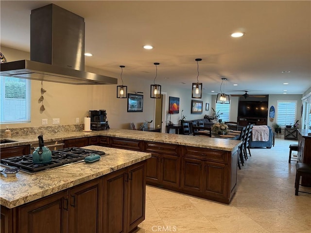 9033 Mandarin Ave, Rancho Cucamonga, CA 91701 - kitchen with island exhaust hood, stainless steel gas cooktop, ceiling fan, open floor plan, and recessed lighting