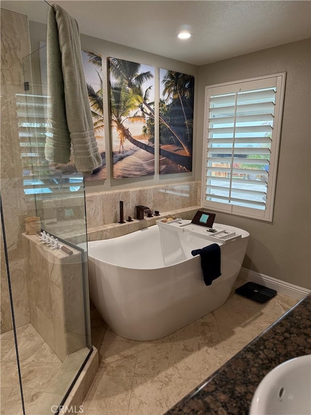 9033 Mandarin Ave, Rancho Cucamonga, CA 91701 - bathroom featuring a freestanding tub, tiled shower, and recessed lighting