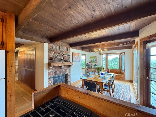 dining room with wooden ceiling, wood-type flooring, beam ceiling, a brick fireplace, and a notable chandelier