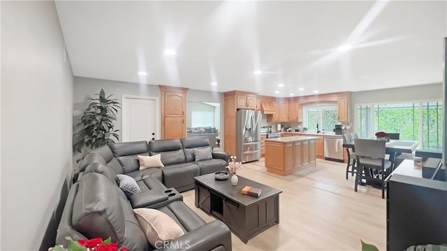 living room featuring light wood-style floors and recessed lighting