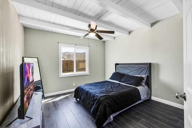 6558 Juniper Ave Unit 29, Palms, CA 92277 - bedroom with baseboards, beam ceiling, dark wood-type flooring, and ceiling fan