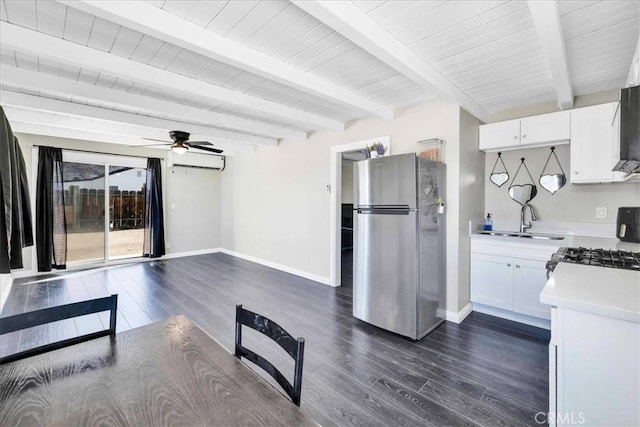 6558 Juniper Ave Unit 29, Palms, CA 92277 - kitchen featuring a sink, ceiling fan, dark wood finished floors, baseboards, and freestanding refrigerator