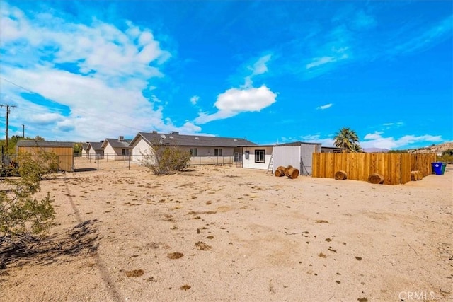 6558 Juniper Ave Unit 29, Palms, CA 92277 - rear view of property featuring fence private yard