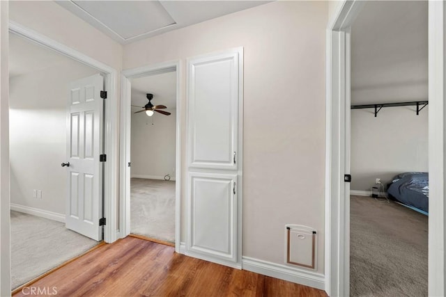 12521 Mcferon Rd, Poway, CA 92064 - corridor featuring light carpet, baseboards, and light wood-style flooring