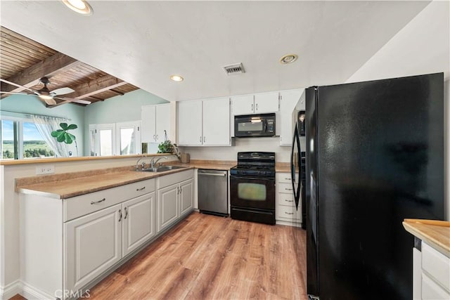 12521 Mcferon Rd, Poway, CA 92064 - kitchen with black appliances, a sink, light wood-style floors, beamed ceiling, and white cabinets