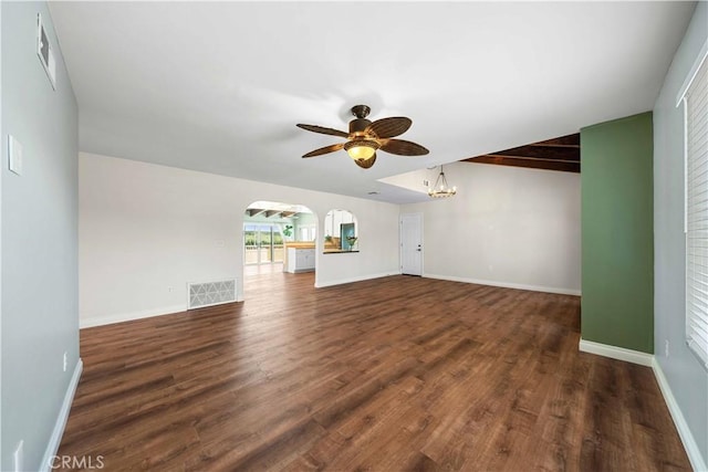 12521 Mcferon Rd, Poway, CA 92064 - unfurnished living room with arched walkways, a ceiling fan, wood finished floors, a chandelier, and baseboards
