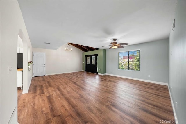 12521 Mcferon Rd, Poway, CA 92064 - unfurnished living room with ceiling fan, a chandelier, wood finished floors, arched walkways, and lofted ceiling