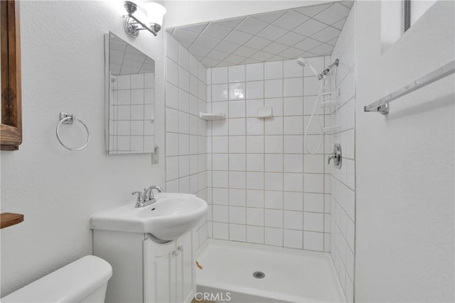 305 Beverly Ave, Barstow, CA 92311 - bathroom featuring a tile shower and vanity