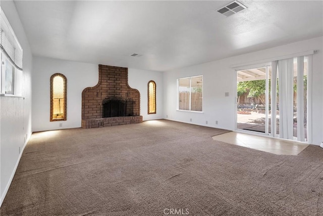 305 Beverly Ave, Barstow, CA 92311 - unfurnished living room with carpet flooring and a fireplace