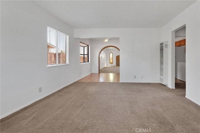 305 Beverly Ave, Barstow, CA 92311 - carpeted spare room with arched walkways and a heating unit