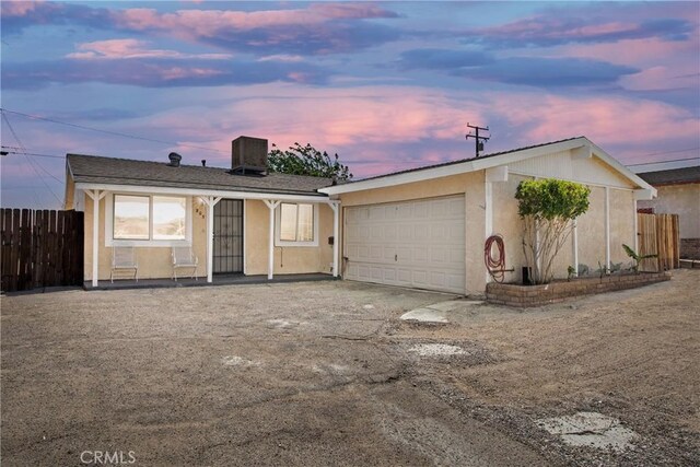 305 Beverly Ave, Barstow, CA 92311 - single story home with fence, a garage, stucco siding, and central air condition unit