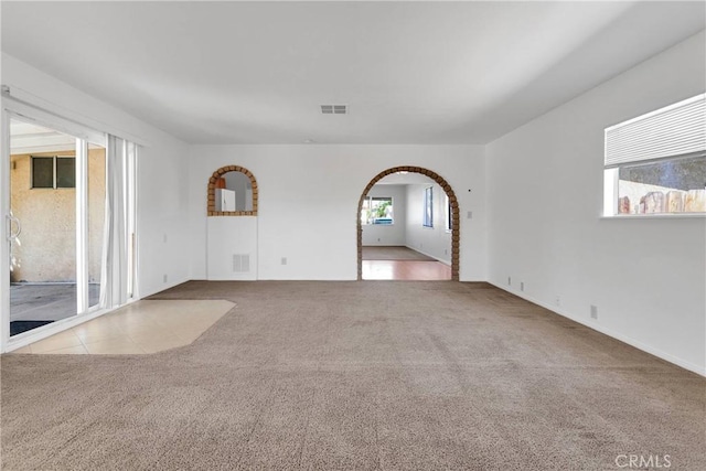 305 Beverly Ave, Barstow, CA 92311 - carpeted spare room with arched walkways