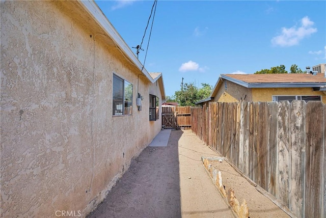 305 Beverly Ave, Barstow, CA 92311 - view of property exterior with stucco siding and a gate