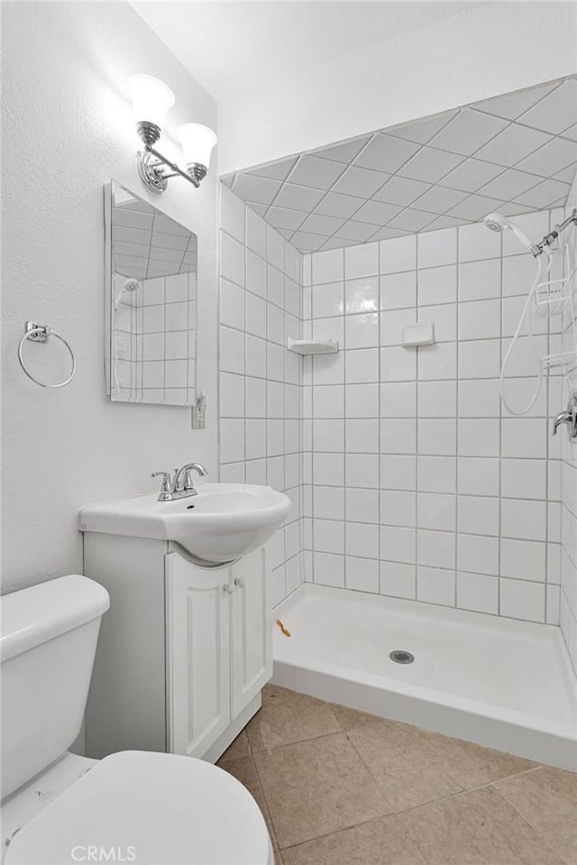 305 Beverly Ave, Barstow, CA 92311 - bathroom featuring a shower stall, vanity, and tile patterned floors