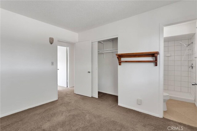 305 Beverly Ave, Barstow, CA 92311 - unfurnished bedroom with carpet flooring, a closet, and ensuite bathroom