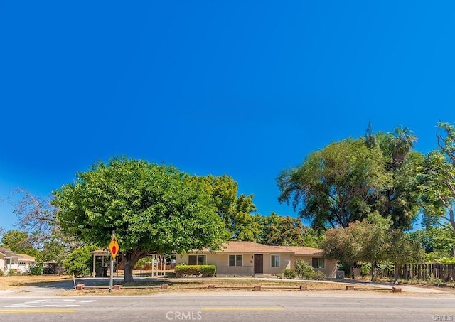 single story home with fence