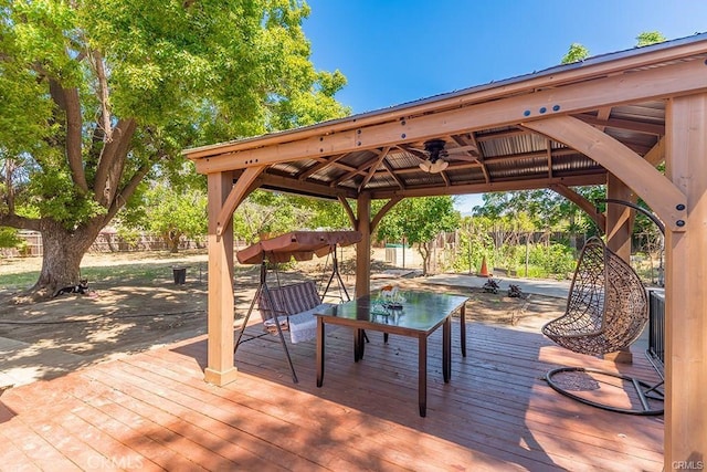 wooden terrace with fence and a gazebo
