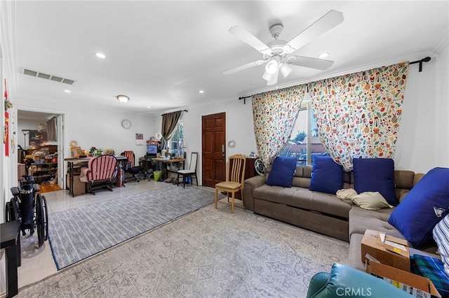 living room with visible vents, a wealth of natural light, recessed lighting, and ornamental molding