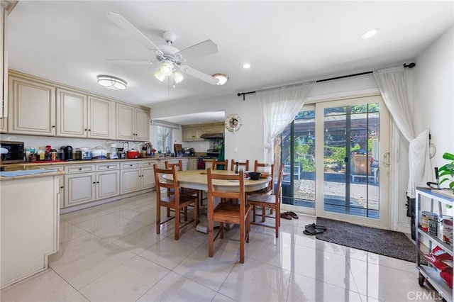 dining area featuring a ceiling fan, a healthy amount of sunlight, light tile patterned flooring, and recessed lighting