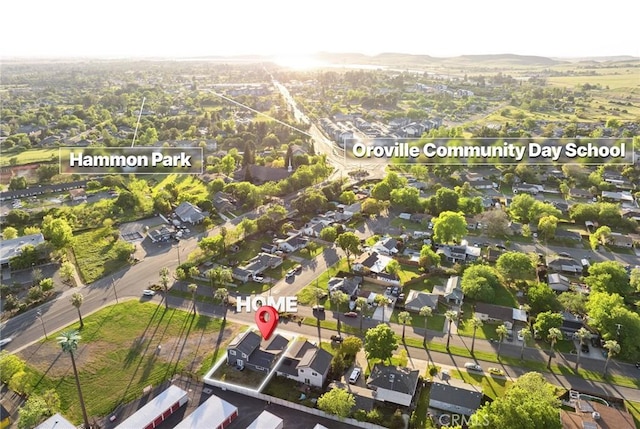 birds eye view of property with a mountain view and a residential view
