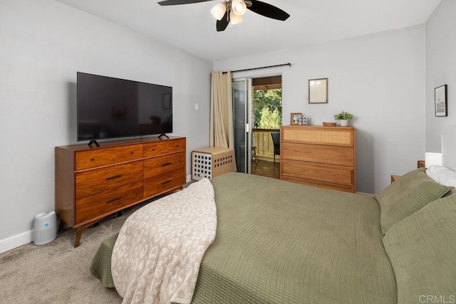 carpeted bedroom with access to outside, a ceiling fan, and baseboards