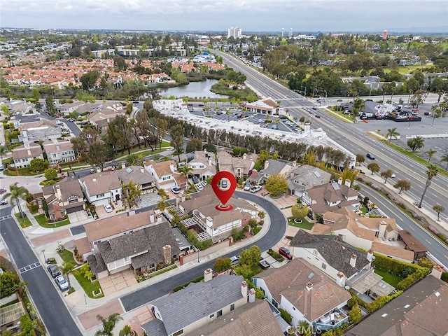 birds eye view of property featuring a residential view and a water view
