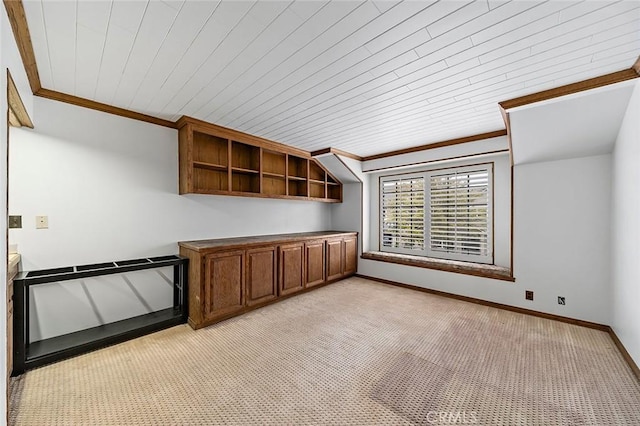unfurnished office featuring light carpet, baseboards, and ornamental molding