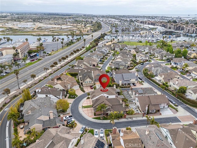 birds eye view of property featuring a residential view and a water view