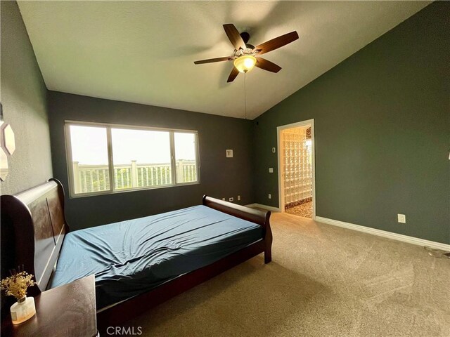 carpeted bedroom with ceiling fan, lofted ceiling, and baseboards