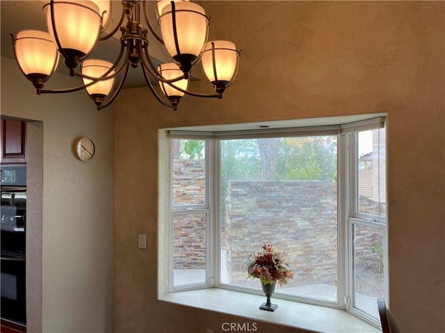room details with an inviting chandelier and dobule oven black