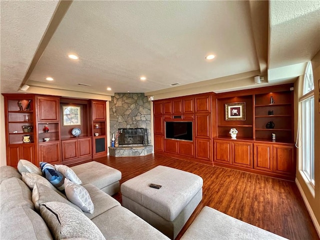 21062 Quail Run Dr, Diamond Bar, CA 91789 - living area with a textured ceiling, wood finished floors, a fireplace, built in shelves, and recessed lighting