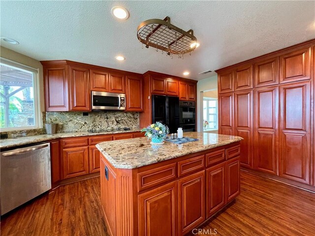 21062 Quail Run Dr, Diamond Bar, CA 91789 - kitchen featuring black appliances, dark wood-style floors, healthy amount of natural light, a textured ceiling, and recessed lighting