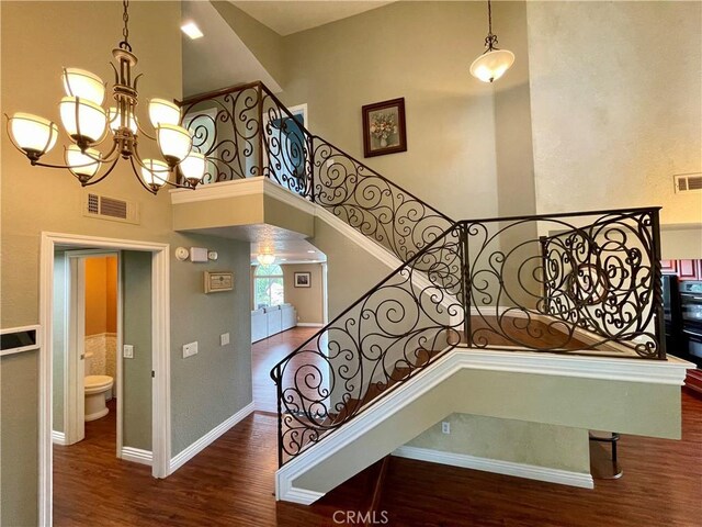 21062 Quail Run Dr, Diamond Bar, CA 91789 - stairway featuring wood finished floors, a chandelier, and a high ceiling