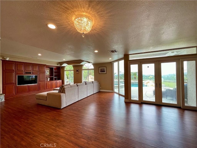 21062 Quail Run Dr, Diamond Bar, CA 91789 - unfurnished living room with a textured ceiling, wood finished floors, french doors, recessed lighting, and a chandelier